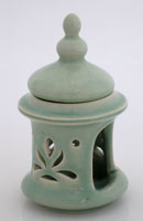 celadon glazed ceramic temple diffuser with lotus flower pierced on wall, difusor de escencia ceramico en color celadon con flor de loto caklada en pared