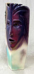 large square vase with faces modeled on the wet clay and latter air brushed with striking purple and turquoise glazes, vaso cuadrado grande de stoneware con caras modeladas en el barro humedo y despues pintdas con impactantes colores morado y turqueza